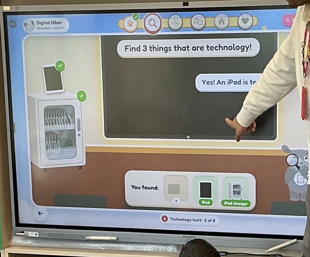 Reception Lesson 1 on the classroom screen: find three things that are technology